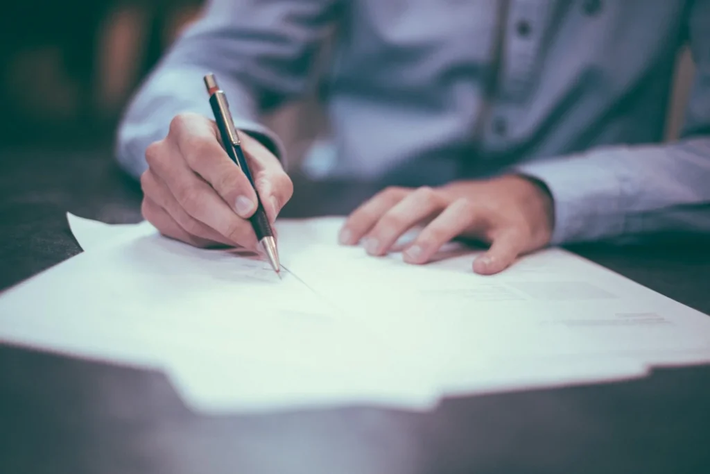 Lawyer reviewing legal documents and planning a new solo practice.